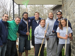 A group of PASS Americorps team members with rakes.